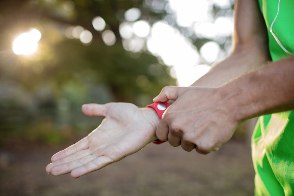 The image shows an athlete training with one of the best wearable heart rate monitors.